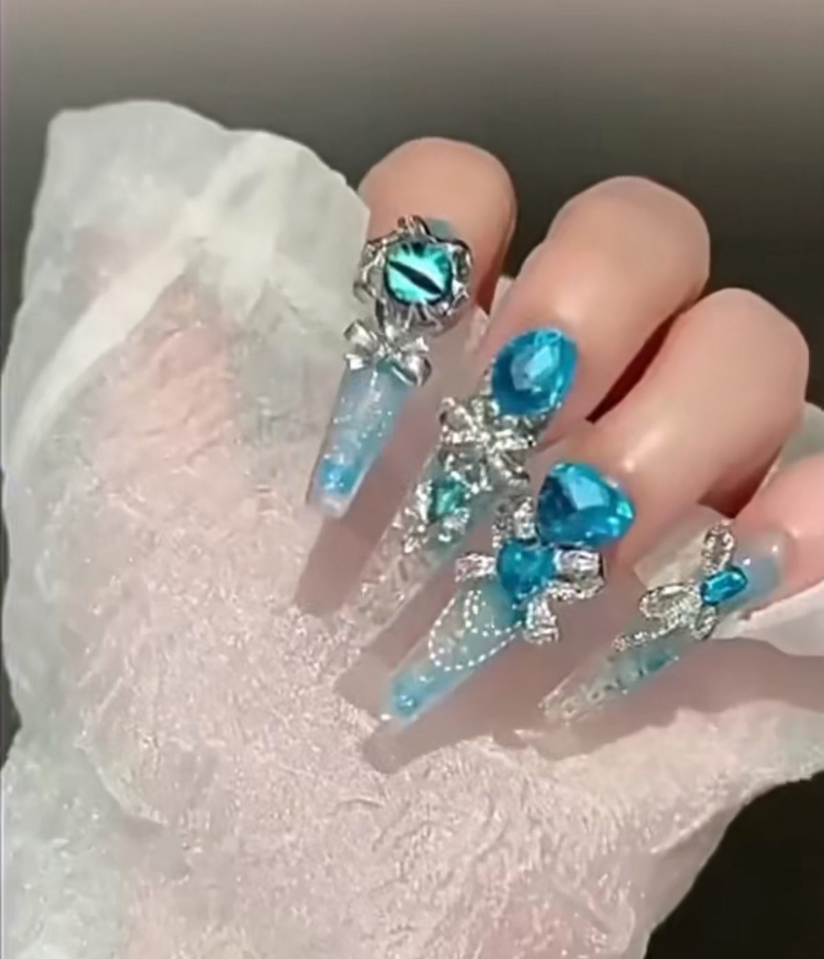 Handmade press-on nails: blue quicksand, elegant, luxurious, heavily detailed, whitening, and seductive