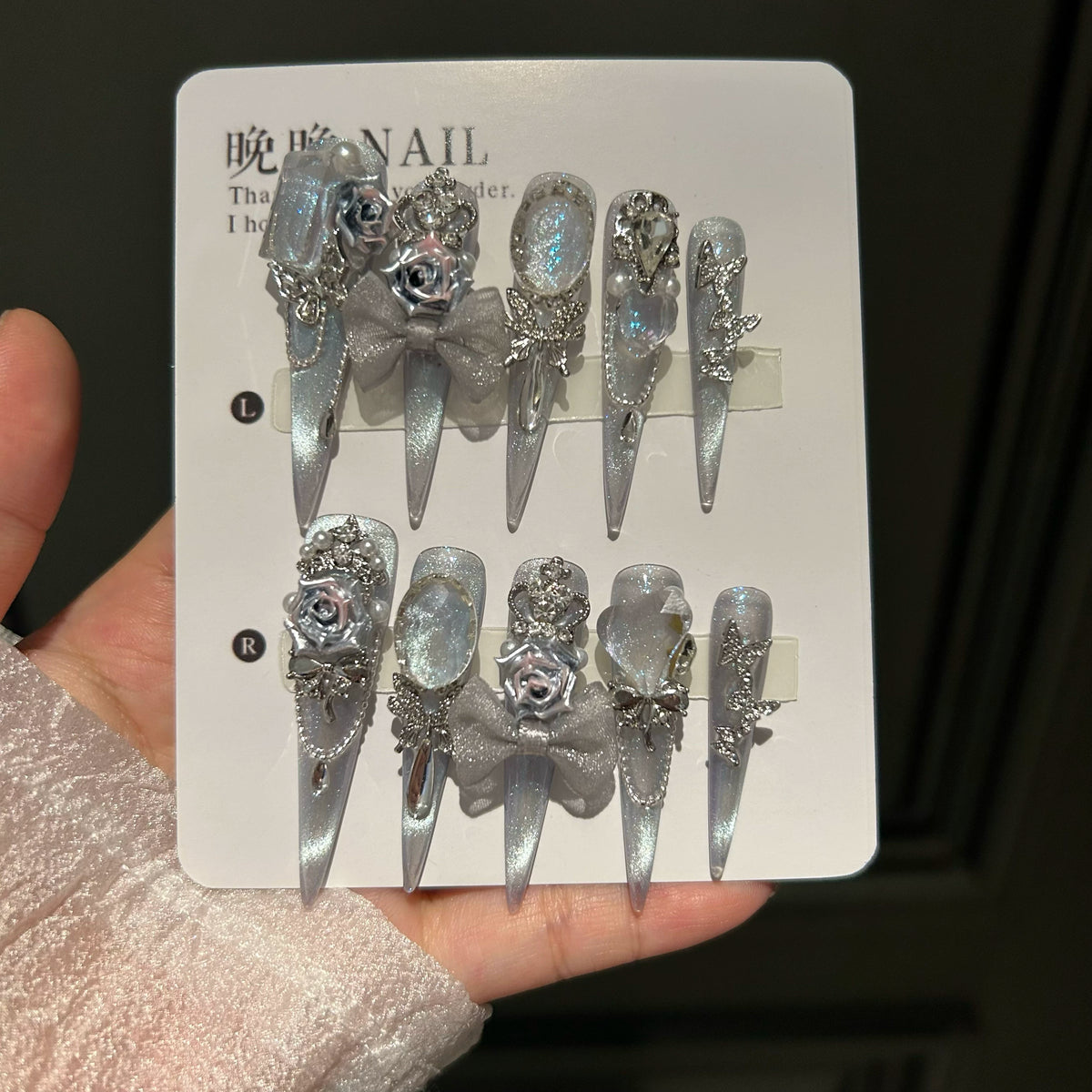 Handcrafted press-on nails featuring an original, sophisticated "cat-eye" design that flatters the skin tone and exudes elegance.