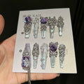 Hand-painted, long press-on nails featuring embroidery-style designs, color-blocking, and a cat-eye effect—entirely handmade.